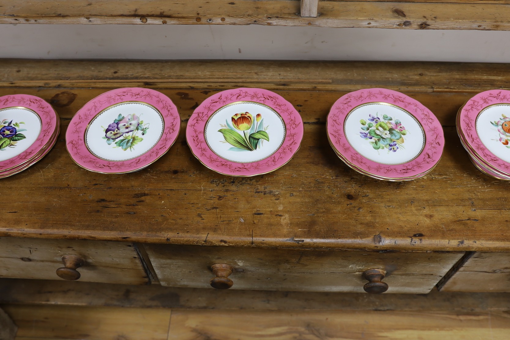 An English porcelain pink ground floral dessert service, late 19th century